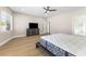 Bright bedroom with sleek dresser, wood floors, recessed lighting, and ensuite bathroom at 9916 Dusty Winds Ave, Las Vegas, NV 89117