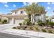 Charming two-story home with well-maintained landscaping, featuring a three-car garage at 9916 Dusty Winds Ave, Las Vegas, NV 89117