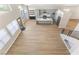 Open-concept living area with modern kitchen and lots of natural light at 9916 Dusty Winds Ave, Las Vegas, NV 89117