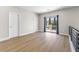 Open loft space with wood floors, balcony access, and natural light at 9916 Dusty Winds Ave, Las Vegas, NV 89117