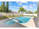 Inviting backyard with a sparkling pool and spa combination, and well-maintained landscaping at 9916 Dusty Winds Ave, Las Vegas, NV 89117