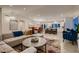 Inviting living room with an open layout, seamlessly flowing into dining and kitchen areas at 6316 Bluejay Way, Las Vegas, NV 89146