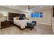 Relaxing main bedroom features a decorative headboard, bench, and a window view at 6316 Bluejay Way, Las Vegas, NV 89146