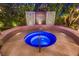 Close-up of a modern spa with beautiful tile work and a lush garden backdrop at 6316 Bluejay Way, Las Vegas, NV 89146