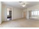 Open bedroom with double mirrored closet and bathroom access at 10381 Walking View Ct, Las Vegas, NV 89135