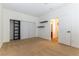 Neutral bedroom with tan carpet, closet, and an open doorway to the bathroom at 10381 Walking View Ct, Las Vegas, NV 89135