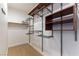 Walk-in closet with adjustable shelving and safe for valuables at 10381 Walking View Ct, Las Vegas, NV 89135