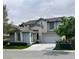 Charming two-story home featuring a two-car garage, landscaped yard, and classic suburban appeal at 10381 Walking View Ct, Las Vegas, NV 89135