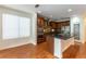 Modern kitchen featuring an island with granite countertop, stainless appliances, and wooden cabinets at 10381 Walking View Ct, Las Vegas, NV 89135