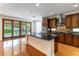 Modern kitchen featuring granite countertops, stainless steel appliances, and an island at 10381 Walking View Ct, Las Vegas, NV 89135