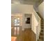 Bright living room featuring hardwood floors, a staircase, and a fireplace at 10381 Walking View Ct, Las Vegas, NV 89135