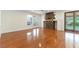 Spacious living room with hardwood floors, a fireplace, and outdoor access at 10381 Walking View Ct, Las Vegas, NV 89135