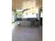 Well-equipped outdoor kitchen with built in grill, stainless steel appliances, and bar seating at 10381 Walking View Ct, Las Vegas, NV 89135