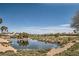 Community landscape including golf course, ponds, mature trees, and desert landscaping at 10547 Grazia Ave, Las Vegas, NV 89135