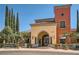 Beautiful Siena Clubhouse featuring an arched entryway, well-manicured landscaping, and a stately facade at 10547 Grazia Ave, Las Vegas, NV 89135