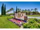Welcome to Siena! Gorgeous sign featuring beautiful landscaping and colorful flowers at 10547 Grazia Ave, Las Vegas, NV 89135