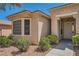 Charming home exterior with a bay window, manicured bushes, and a welcoming front entrance at 10547 Grazia Ave, Las Vegas, NV 89135