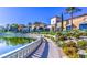 Stunning landscaping and Mediterranean-style architecture surround a beautiful community lake at 10547 Grazia Ave, Las Vegas, NV 89135