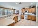 Bright kitchen features light wood cabinets, modern appliances, and a double sink at 10547 Grazia Ave, Las Vegas, NV 89135