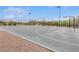 Outdoor community basketball court with mature landscaping, lighting, and sidewalks at 10664 Mount Jefferson Ave, Las Vegas, NV 89166