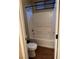 This bathroom features a shower over tub with white surround and wood-look floors at 10664 Mount Jefferson Ave, Las Vegas, NV 89166