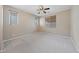 This bedroom has carpeted floors and features windows with blinds for privacy at 10664 Mount Jefferson Ave, Las Vegas, NV 89166