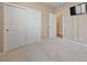 This bedroom offers carpeted floors and features a closet with double doors for ample storage at 10664 Mount Jefferson Ave, Las Vegas, NV 89166