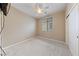 Cozy bedroom with plush carpeting, ceiling fan, and closet at 10664 Mount Jefferson Ave, Las Vegas, NV 89166