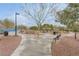 Picturesque community park with walking paths, benches, lush landscaping and mature trees at 10664 Mount Jefferson Ave, Las Vegas, NV 89166