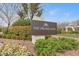 Elegant Promenade community entrance sign surrounded by flowering shrubs, trees and lush greenery at 10664 Mount Jefferson Ave, Las Vegas, NV 89166