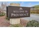 Welcome to Providence community sign with stacked stone base, flowering bushes and well maintained landscape at 10664 Mount Jefferson Ave, Las Vegas, NV 89166