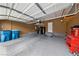 Spacious garage with ample storage, epoxy flooring, and overhead racks at 10664 Mount Jefferson Ave, Las Vegas, NV 89166