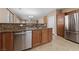 A full kitchen with stainless steel dishwasher and double sink at 10664 Mount Jefferson Ave, Las Vegas, NV 89166