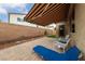 Paver patio with retractable awning, ideal for outdoor relaxation and entertaining at 10664 Mount Jefferson Ave, Las Vegas, NV 89166