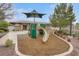 Community playground with climbing structure, slide, and sunshade provides fun outdoor activity at 10664 Mount Jefferson Ave, Las Vegas, NV 89166