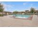 Large community pool with plenty of lounge chairs and lush landscaping at 10664 Mount Jefferson Ave, Las Vegas, NV 89166