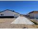 View of the backyard area, long driveway and detached garage at 1083 E Calvada Blvd, Pahrump, NV 89048