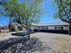 Charming single-story home with a porte cochere and desert landscaping in a sunny environment at 1083 E Calvada Blvd, Pahrump, NV 89048