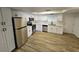 Spacious kitchen features white cabinets, stainless steel appliances, and modern flooring at 1083 E Calvada Blvd, Pahrump, NV 89048