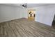 The spacious living room features modern flooring and a ceiling fan at 1083 E Calvada Blvd, Pahrump, NV 89048
