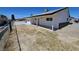 View of the back exterior with a patio and block fence, showcasing the single story property at 1083 E Calvada Blvd, Pahrump, NV 89048
