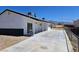 Rear exterior featuring a patio, backyard, and black brick trim on this single story home at 1083 E Calvada Blvd, Pahrump, NV 89048