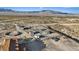 Aerial shot showing a home and equestrian facilities, with mountain views and desert landscape at 11875 Maggie Ave, Las Vegas, NV 89166