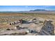 Panoramic aerial view of desert property with home, sheds, and equestrian facilities at 11875 Maggie Ave, Las Vegas, NV 89166