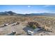 Expansive aerial view of the property, buildings and the surrounding desert landscape at 11875 Maggie Ave, Las Vegas, NV 89166