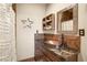 Charming bathroom with granite counters, copper vessel sink, and rustic wood accents at 11875 Maggie Ave, Las Vegas, NV 89166