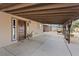 Covered patio featuring a decorative front door with seating overlooking the property and mountain views at 11875 Maggie Ave, Las Vegas, NV 89166