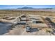 Aerial shot showcasing equestrian facilities including stables, riding pens, and trailer parking at 11875 Maggie Ave, Las Vegas, NV 89166