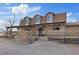 Inviting ranch-style home boasting a covered porch, wagon wheel decor, and a rustic split rail fence at 11875 Maggie Ave, Las Vegas, NV 89166