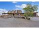 Spacious ranch-style home featuring a covered porch, adjacent garage, and well-maintained landscaping at 11875 Maggie Ave, Las Vegas, NV 89166